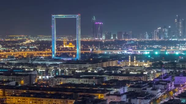 Dubai Frame with Zabeel Masjid mosque illuminated at night timelapse. — Stock Video