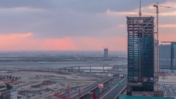 Sunrise légi kilátás pénzügyi központ közúti reggeli TimeLapse az építkezés — Stock videók