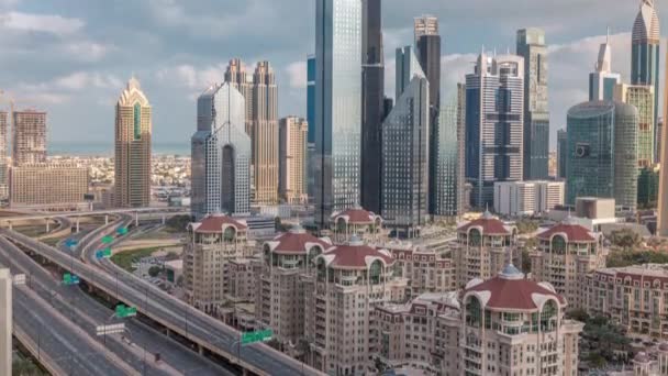 Aerial view of skyscrapers and road junction in Dubai timelapse — Stock Video