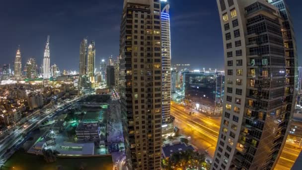 Beautiful skyline of Dubai downtown and Business bay with modern architecture night timelapse. — Stock Video