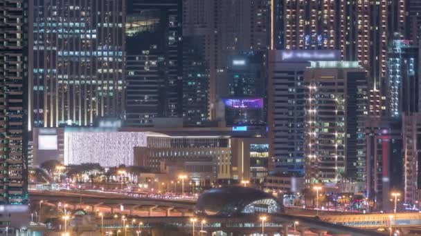 Dubai Marina Wolkenkratzer und Golfplatz Nacht Zeitraffer, Dubai, Vereinigte Arabische Emirate — Stockvideo