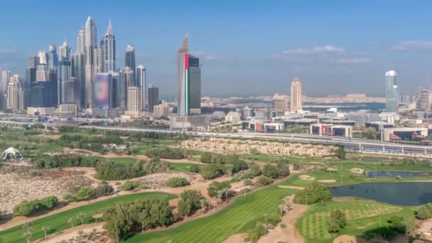 Dubai Marina skyscrapers and golf course morning timelapse, Dubai, ОАЭ — стоковое видео