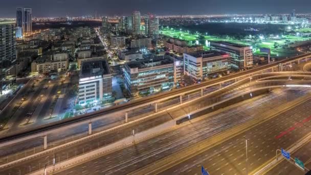 Vista aérea de los distritos de Tecom, Barsha y Greens desde el timelapse nocturno de Internet — Vídeo de stock