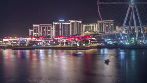 Bluewaters Island in Dubai aerial night timelapse with illuminated buildings. — Stock Video