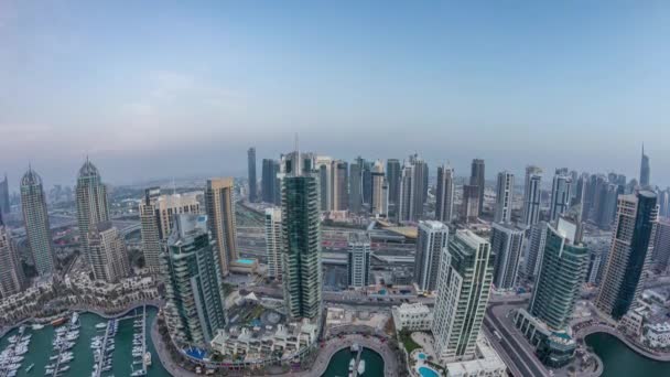 Aerial top view of Dubai Marina day to night timelapse. Modern towers and traffic on the road — Stock Video