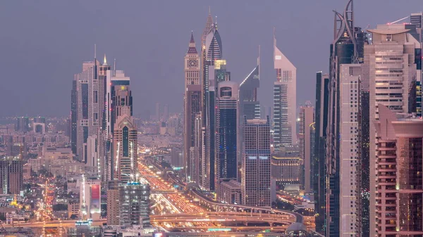 Aerial view to skyscrapers on Dubai downtown and Sheikh Zayed road day to night timelapse, Dubai, United Arab Emirates — Stock Photo, Image