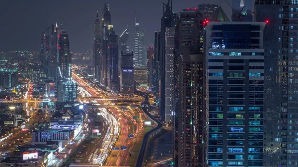 Aerial view to skyscrapers on Dubai downtown and Sheikh Zayed road night timelapse, Dubai, United Arab Emirates — Stock Photo, Image