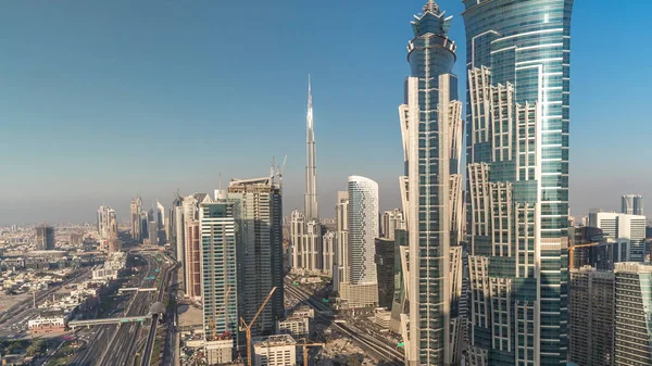 Sunset skyline with modern skyscrapers and traffic on sheikh zayed road timelapse in Dubai, UAE. — Stock Photo, Image