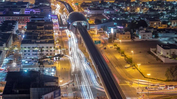 Metro station and traffic on the night road timelapse. Aerial view from the top of the building. — Stock Photo, Image