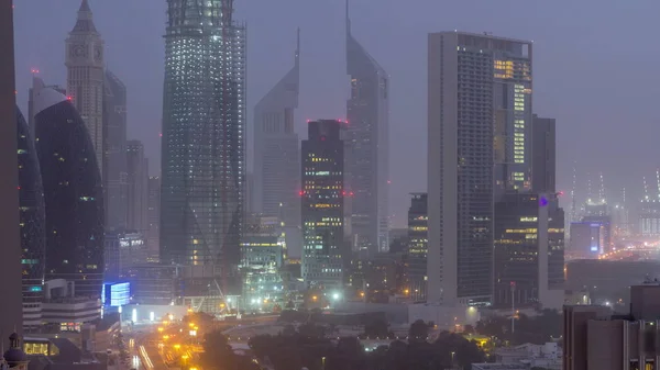 Dubai downtown skyline night to day aerial timelapse with traffic on highway — Stock Photo, Image