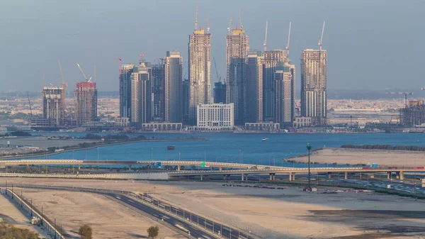 Új felhőkarcolók építése a Dubai Creek Harbor-i légi timelapdon. Dubai-Egyesült Arab Emírségek. — Stock Fotó