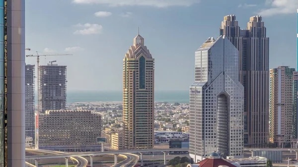 Aerial view of skyscrapers and road junction in Dubai timelapse — Stock Photo, Image