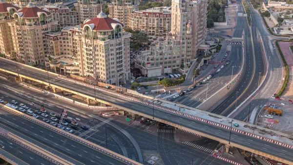 Aerial view of highway interchange in Dubai downtown evening timelapse. — Stock Photo, Image