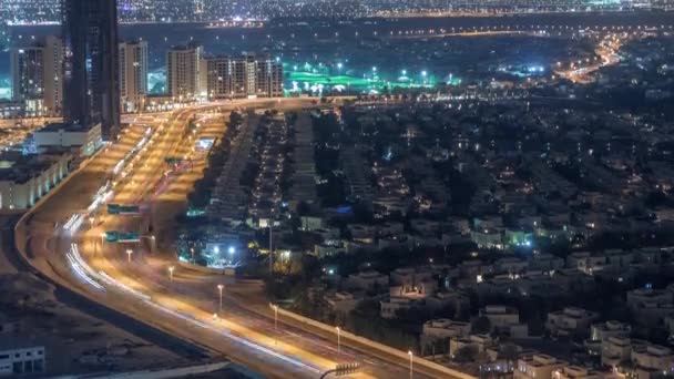 Aerial view of apartment houses and villas in Dubai city night timelapse, United Arab Emirates — Stock Video