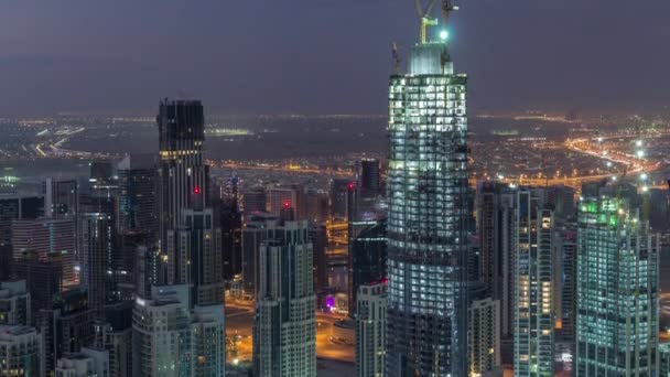 Increíble vista aérea de los rascacielos del centro de Dubái noche a día timelapse, Dubái, Emiratos Árabes Unidos — Vídeos de Stock