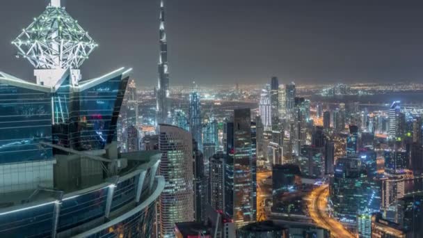 Panoramische luchtfoto van Business Bay Towers in Dubai Night timelapse. — Stockvideo