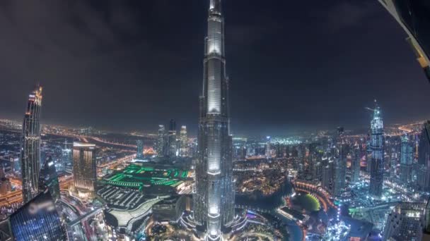 Paniramic skyline view of Dubai downtown with mall, fountains and Burj Khalifa aerial night timelapse — Stock Video