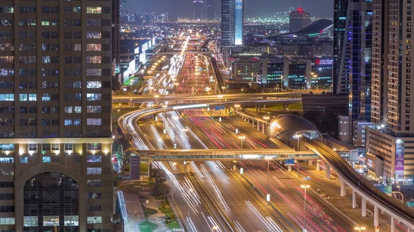 Skyline internet city with crossing Sheikh Zayed Road aerial night timelapse — Stock Photo, Image