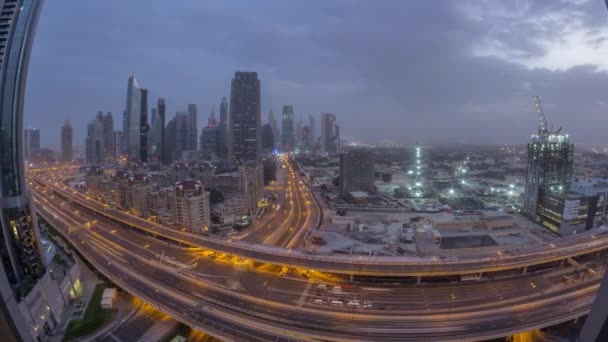 Dubai downtown skyline night to day aerial timelapse with traffic on highway — Stock Video