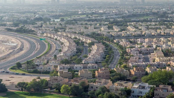 Aerial view to villas and houses with Golf course with green lawn and lakes timelapse — Stock Photo, Image