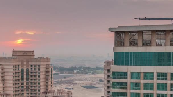 Sunrise over towers in Greens district aerial view from top timelapse. — Stock Video