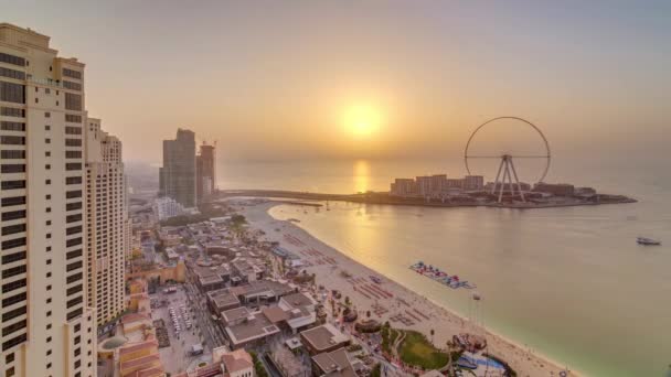 Sunset waterfront overview Jumeirah Beach Residence JBR skyline aerial timelapse with yacht and boats — Stock Video