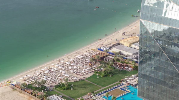 Waterfront overview Jumeirah Beach Residence JBR skyline aerial timelapse with yacht and boats