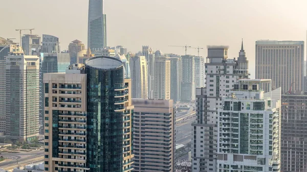 Aerial top view of Dubai Marina evening timelapse. Modern towers and traffic on the road — Stock Photo, Image