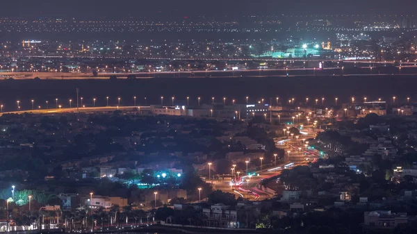 Vista aérea de casas de apartamentos e moradias em Dubai cidade noite timelapse, Emirados Árabes Unidos — Fotografia de Stock