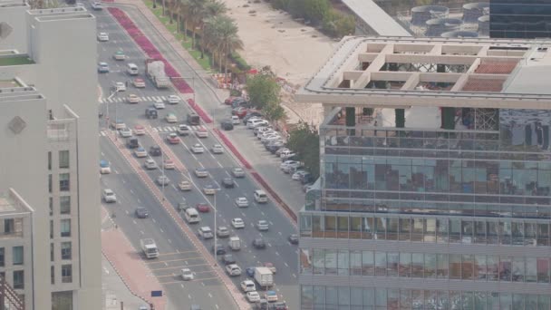 Skyline view of intersection traffic on Al Saada street near DIFC in Dubai, UAE.