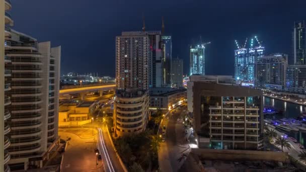 Dubai Marina skyscrapers and promenade air night to day timelapse, Dubai, United Arab Emirates — стокове відео