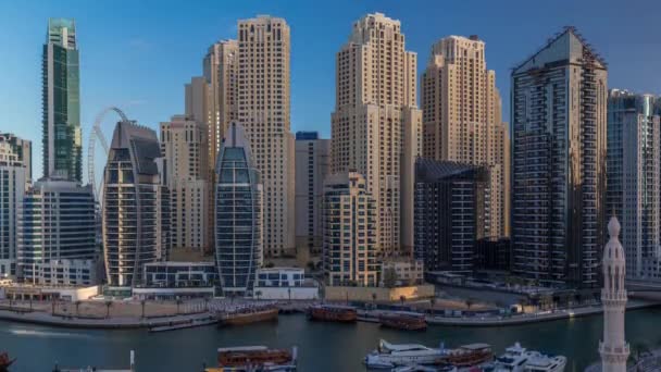 Luxury yachts parked on the pier in Dubai Marina bay with city aerial view timelapse — Stock Video