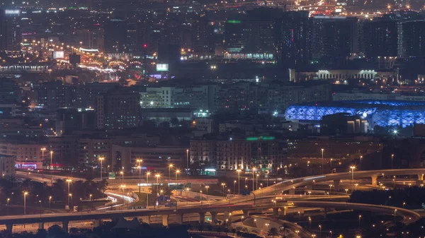 Luchtfoto van buurt Deira en Dubai Creek met typische oude en moderne gebouwen Night timelapse. — Stockfoto