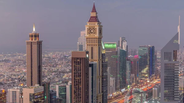 Skyline of the building of Sheikh Zayed Road and DIFC airline day to night timelape in Dubai, UAE . — стоковое фото