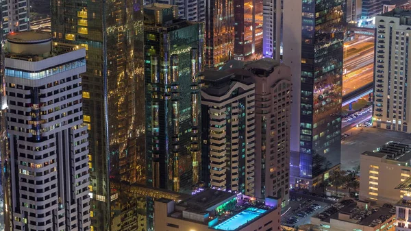 Skyline of the buildings of Sheikh Zayed Road and DIFC aerial night timelapse in Dubai, UAE. — Stock Photo, Image