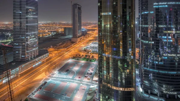 Edificios de oficinas en Jumeirah lago torres distrito noche timelapse en Dubai —  Fotos de Stock