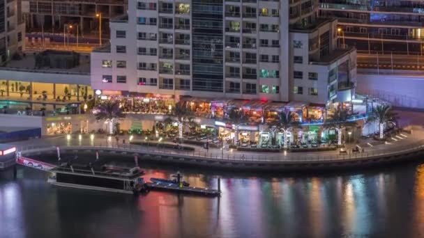 Waterfront promenade in Dubai Marina aerial night timelapse. Dubai, United Arab Emirates — Stock Video