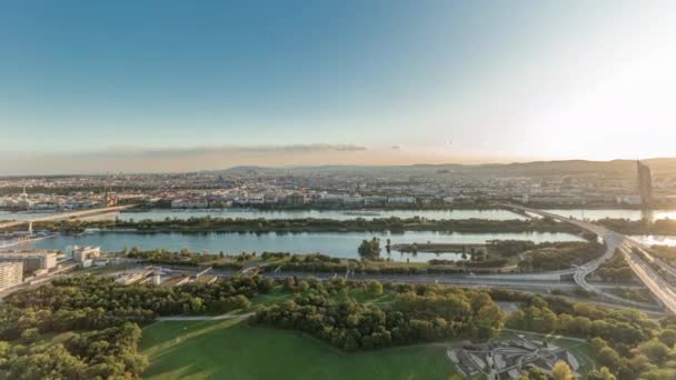 Aerial panoramic view of Vienna city with skyscrapers, historic buildings and a riverside promenade timelapse in Austria. — Stock Video