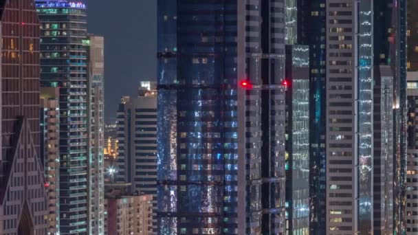 Dubai International Financial Centre district with modern skyscrapers night timelapse — Stock Video