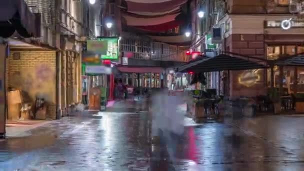 View on Ferhadija pedestrian street crowded with people night timelapse — Stock Video