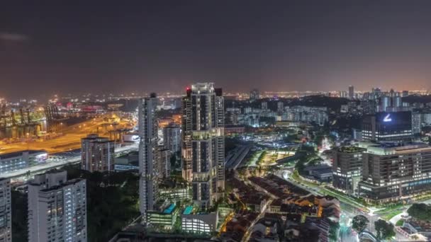 City skyline with commercial port of Singapore aerial night timelapse. — Stock Video