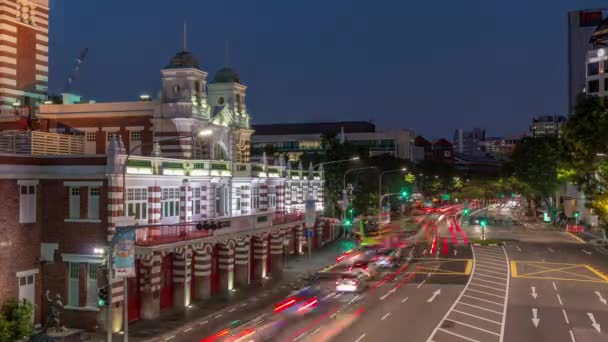 Street traffic near the fire station of Singapore day to night aerial timelapse. — Stock Video