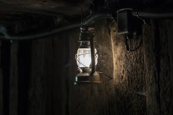 lamp in mine, vintage lantern in dark room