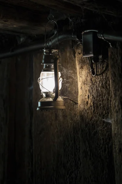 lamp in mine, vintage lantern in dark room