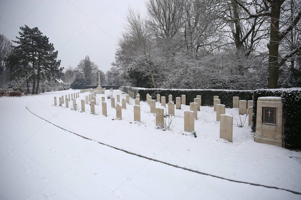 gravestones at wintertime, municipal cemetery in Amsterdam, The Netherlands