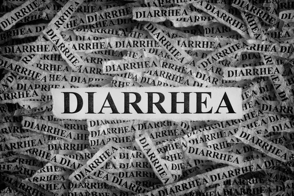 Morceaux de papier déchiré avec les mots Diarrhée — Photo