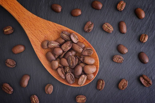 Coffee Beans Wooden Spoon Black Slate Background Close — Stock Photo, Image