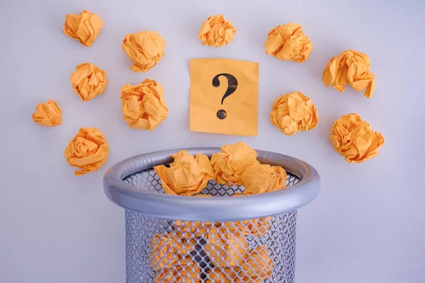 Yellow Crumpled Paper Balls Question Mark Rolling Out Trash Can — Stock Photo, Image