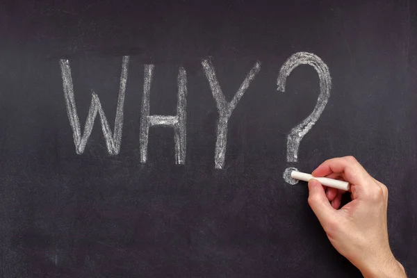 Man writing question Why on chalkboard — Stock Photo, Image