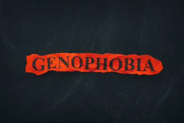 Palabra Genofobia sobre papel rojo desgarrado — Foto de Stock